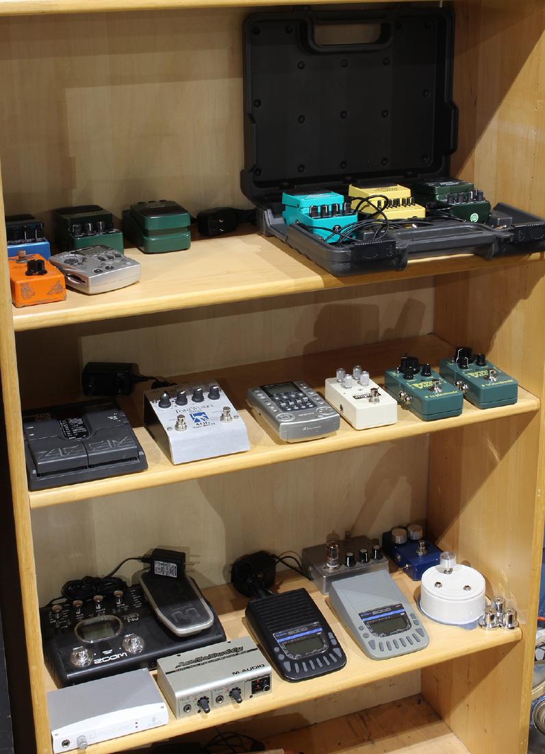 Three shelves of assorted electronic foot pedals and (1 of 1)