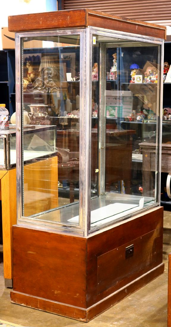Edwardian display vitrine, having a single door opening: Edwardian display vitrine, having a single door opening to adjustable glass shelves above the mahogany stained base, 75"h x 44"w x 23"d