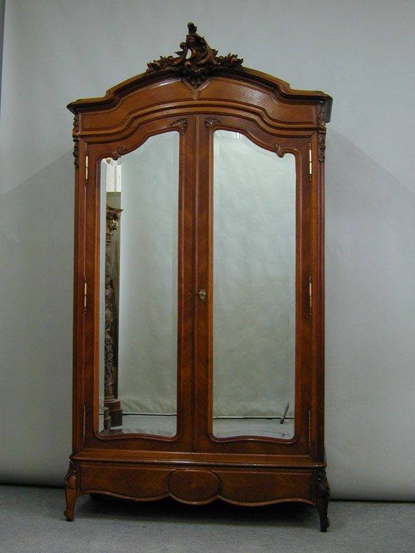 Louis XV style walnut bedroom set: Louis XV style walnut bedroom set, circa 1890, consisting of a mirrored double door armoire, 102''h x 55''w x 18''d, and a carved frame bed with matched veneers, 63''h x 59''w x 77''l