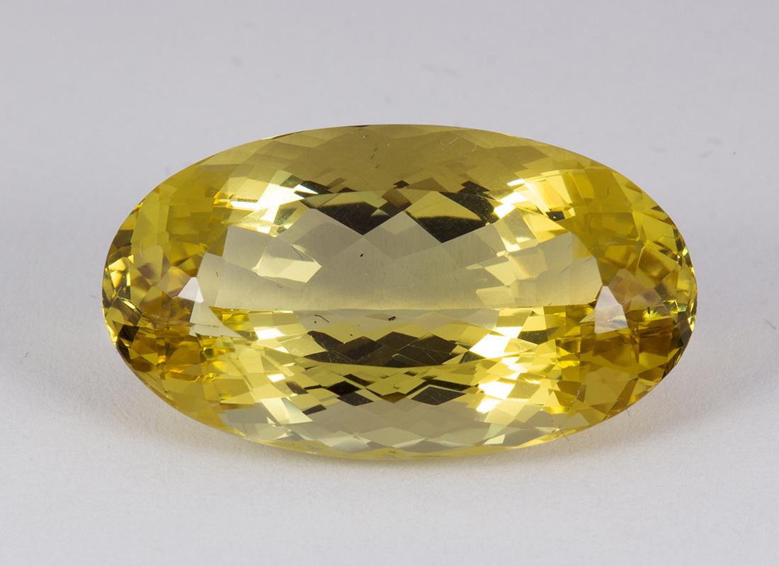 Unmounted beryl: Unmounted beryl The oval-cut golden beryl, measures approximately 25.12 X 14 X 10 mm and weighs 22.18 cts.
