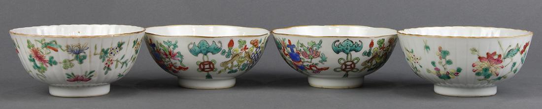 Chinese Porcelain Bowls, Treasures/Flowers: (lot of 4) Chinese porcelain enameled bowls: one pair with Buddhist treasures alternated by bats suspending coins, base with Tongzhi mark; together with a pair of fluted bowls, with insects amid flora