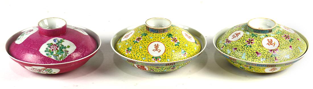 Chinese Porcelain Tureens: (lot of 3) Chinese porcelain lidded tureens: one with floral reserves on a sgraffitto pink ground; two of yellow ground marked 'wan shou wu jiang', 7.5"w; Provenance: Estate of Reynold Tom of Oakland,