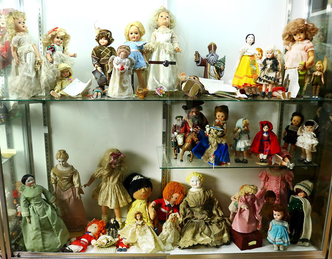 Three shelves of dolls, including a Victorian porcelain (1 of 1)