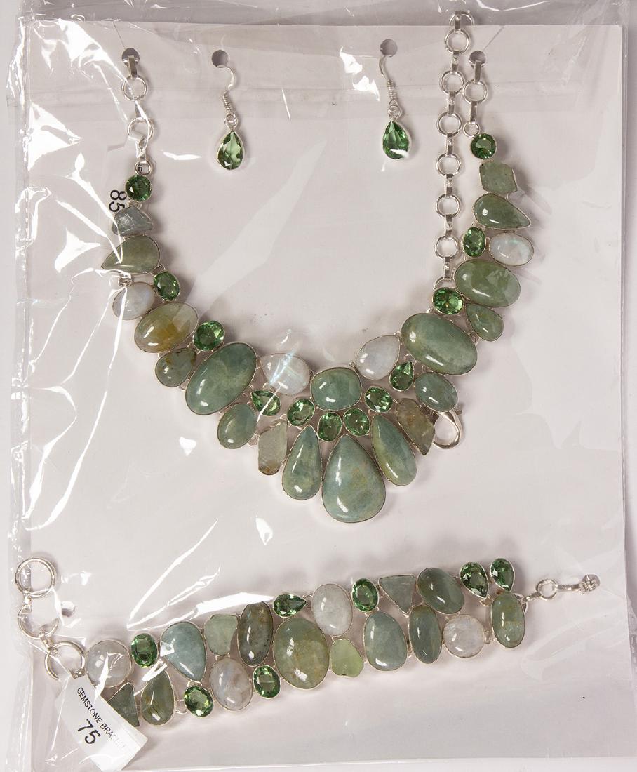 Moonstone, quartz, glass, silver and metal jewelry: Moonstone, quartz, glass, silver and metal jewelry suite Including 1) moonstone, quartz, glass and silver bib style adjustable necklace; 1) pair of glass and silver drop earrings; together with 1) mat