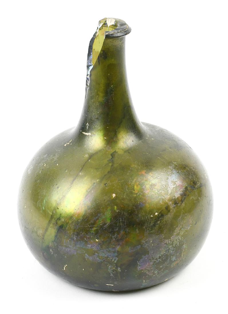 Egypto-Roman iridescent blown glass wine flask: Egypto-Roman iridescent blown glass wine flask, executed in olive green, having a stick neck above a bulbous body, 7"h (note: additional paperwork available)