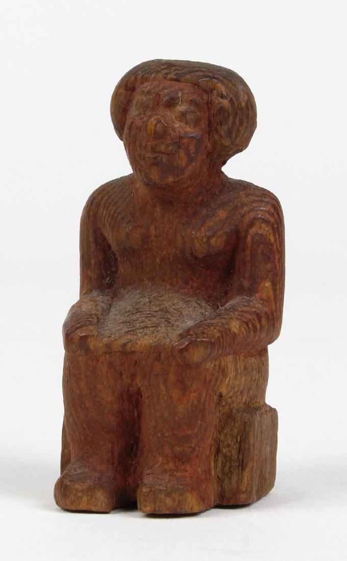 Miniature statuette of an Egyptian noble seated on a (1 of 4)