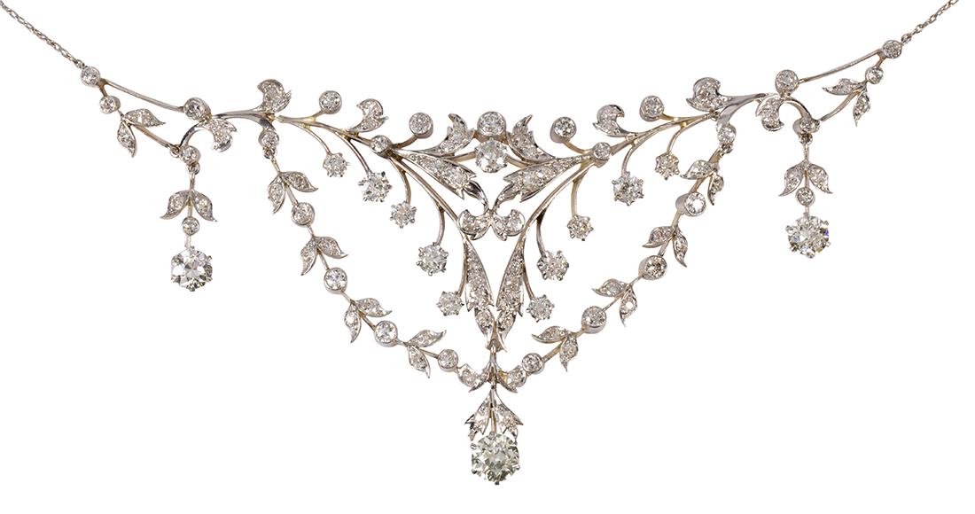 Edwardian diamond, platinum-topped 14k yellow gold bib: Edwardian diamond, platinum-topped 14k yellow gold bib necklace Featuring (1) old European-cut diamond, weighing approximately 1.05 cts., accented by (2) old European-cut diamonds, weighing a total of