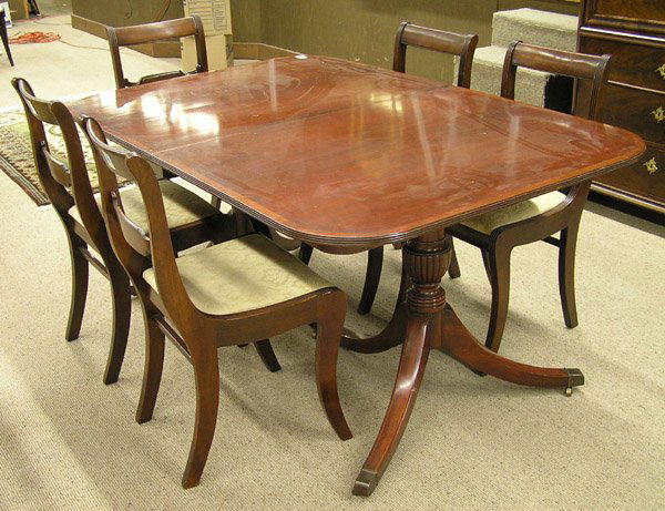 Mahogany Duncan Phyfe style table: Mahogany dining set consisting of a Duncan Phyfe style double pedestal table with band and string inlay, two skirted leaves, and five federal style chairs