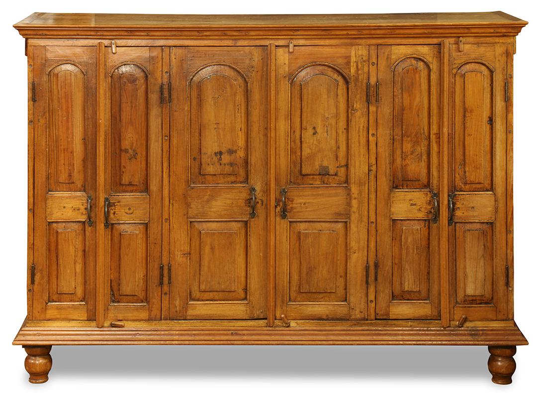 Italian style teak credenza: Italian style teak credenza, having a rectangular top, above paneled doors, and rising on turned legs, 49"h x 64.5"w