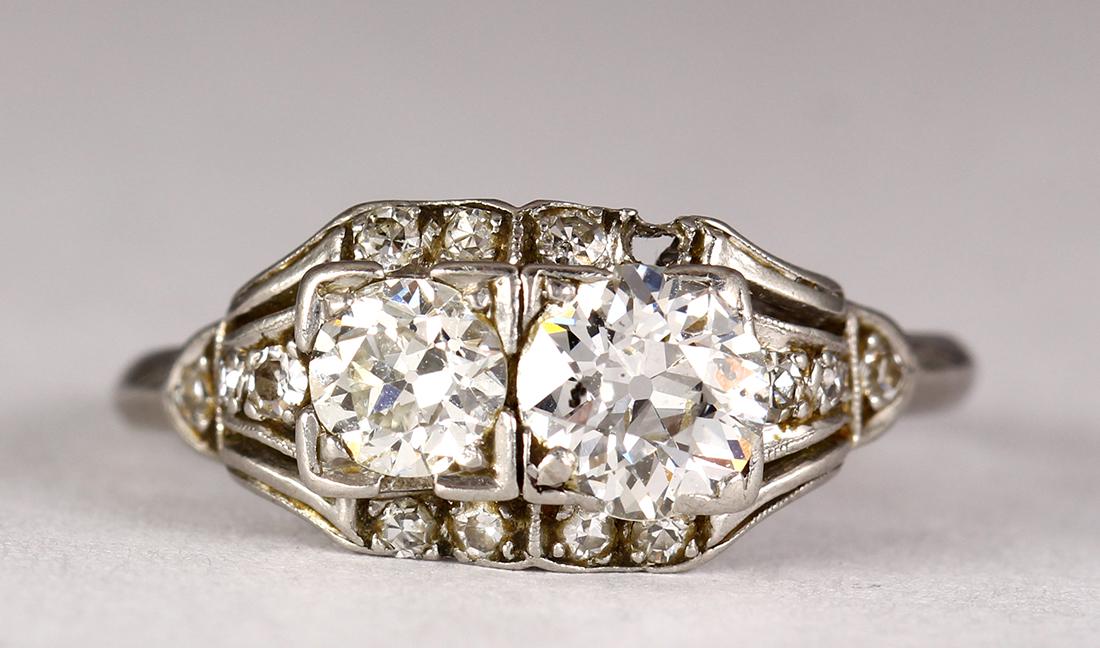 Diamond and platinum ring: Diamond and platinum ring Featuring (2) old European-cut diamonds, weighing a total of approximately 0.80 ct., accented by (13) round-cut diamonds, weighing a total of approximately 0.15 ct., (1 stone