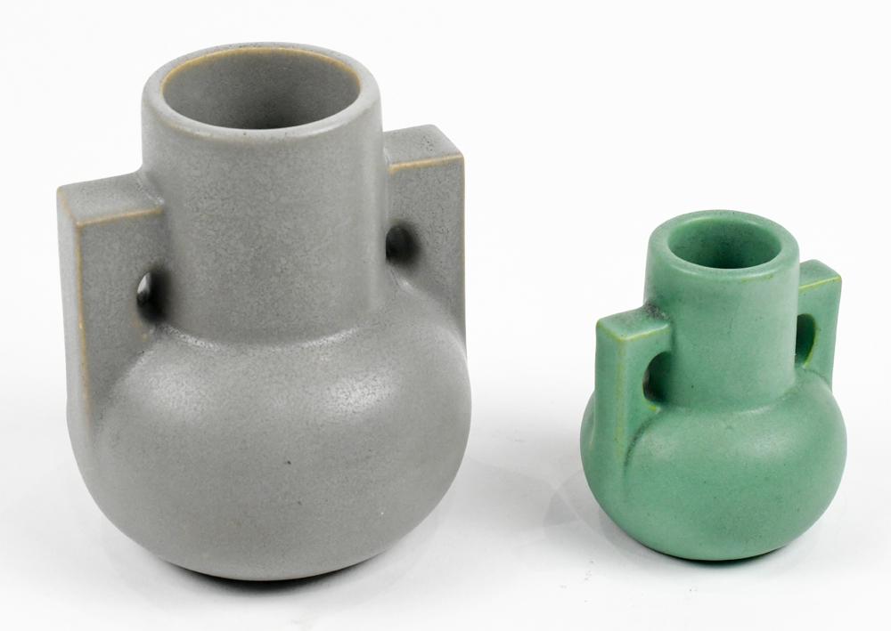 (lot of 2) Two Teco Miniature Art Pottery Urns: (lot of 2) Two Teco Miniature Art Pottery Urns, the baluster form with squared handles, the larger with overall gray glaze (6"h.), the smaller with an overall green glaze (3.5" h.), both with an impre
