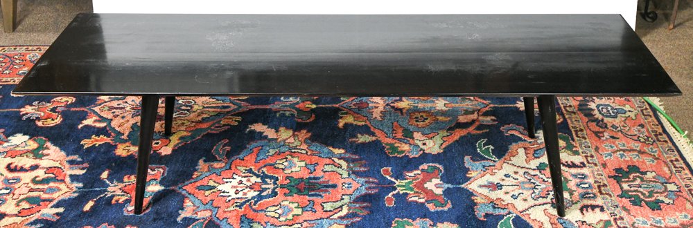 Paul McCobb for the Planner Group by Winchendon black: Paul McCobb for the Planner Group by Winchendon black lacquer wood coffee table, the rectangular outset top on tapered legs, 14.75"h. x 60"w. x 18"d.