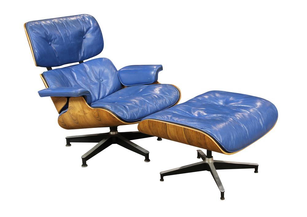 Charles and Ray Eames for Herman Miller 670 lounge: Charles and Ray Eames for Herman Miller 670 lounge chair with matching 671 ottoman, each piece with a molded rosewood frame with tufted blue leather cushions raised on cast propeller base, chair 33"h.