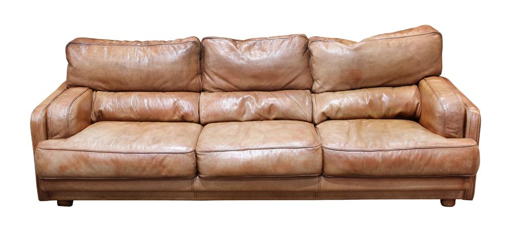 Italian Natuzzi brown leather sofa: Italian Natuzzi brown leather sofa, having a square profile with three seats, 27"h x 83"w x 38"d