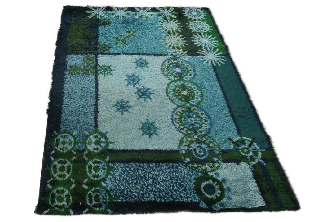 Mid Century Scandinavian carpet: Mid Century Scandinavian carpet, executed in multiple colors with starburst and geometric accents, 6'4" x 9'7"