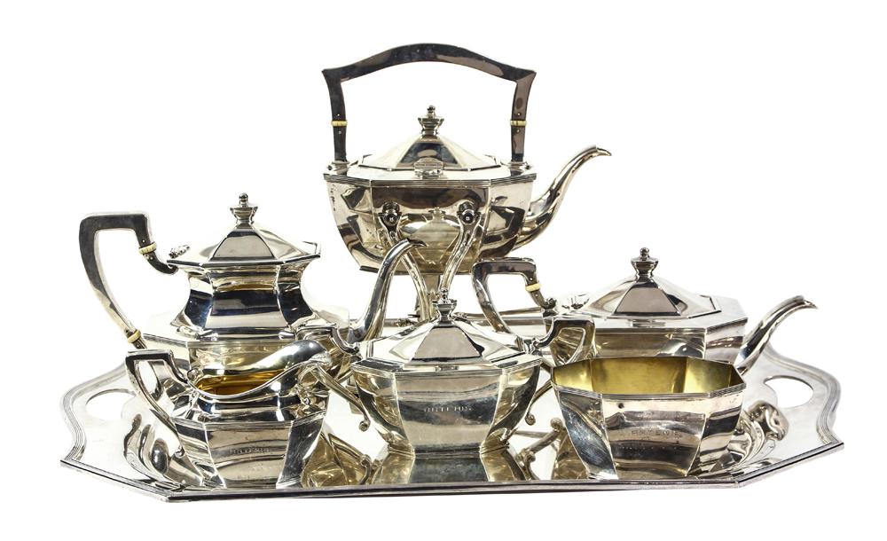 (lot of 8) Black, Starr & Frost sterling silver and: (lot of 8) Black, Starr & Frost sterling silver and gilt wash hot beverage service, consisting of a tea pot, coffee pot, hot water pot, creamer, lidded sugar, stand with burner, and waste bin; togethe