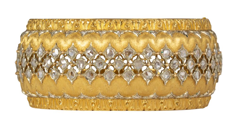 Buccellati diamond and 18k yellow gold bracelet: Buccellati diamond and 18k yellow gold bracelet Featuring (157) rose-cut diamonds, set in an engraved and textured, hinged bangle, measuring approximately 27.4 mm in width, 41 mm widest internal diame