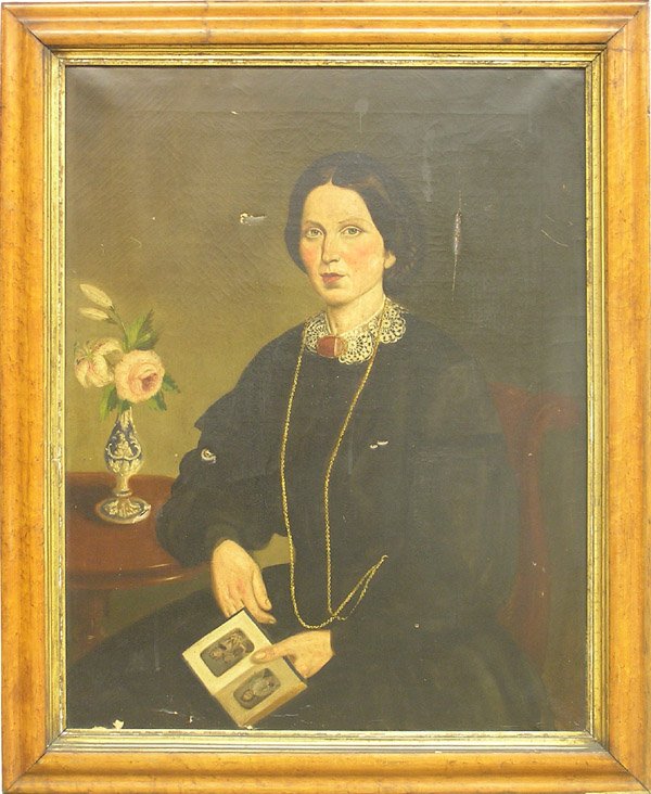Painting, Early American Folk Portrait: Framed oil on canvas, Portrait of a Seated Woman with Photograph Album, manner of Ammi Phillips (American, 1788-1865), unsigned, sight: 35''h x 27''w, overall: 42''h x 34''w. Condition: some punctures