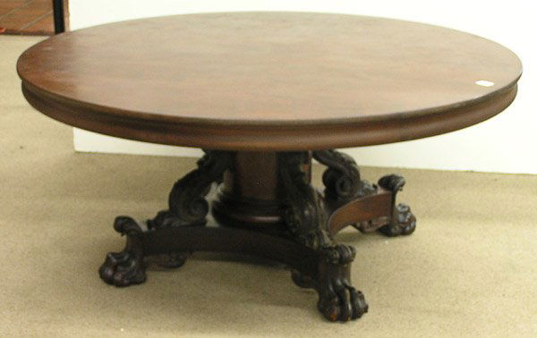 Tobey Hand Made Furniture Co table: Mahogany dining table by Tobey( Hand Made) Furniture Co, circa 1900, having a round, fixed top, 66''d rising on an ornately carved pedestal base ending in hairy paw feet