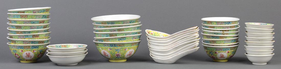 Chinese Porcelain Bowls, Wanshou Wujiang: (lot of 43) Group of Chinese porcelain bowls, each of a yellow ground with 'wan shou wu jiang' roundels amid flowering scrolls, base with apocryphal Guangxu mark, consisting of six 5-inch bowls, eight