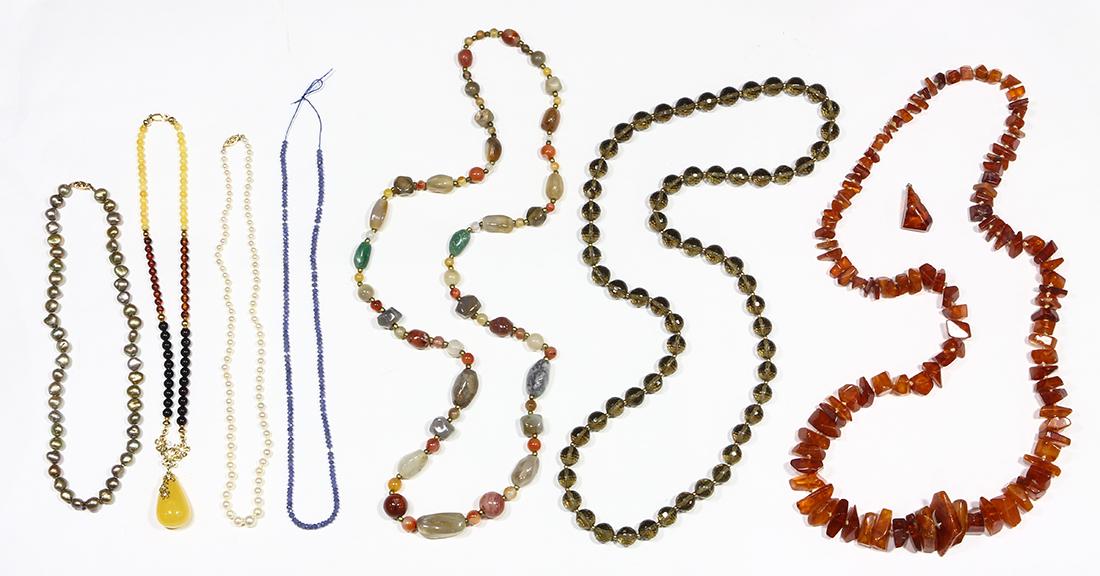 Collection of amber, agate, tanzanite, smokey quartz, (1 of 2)