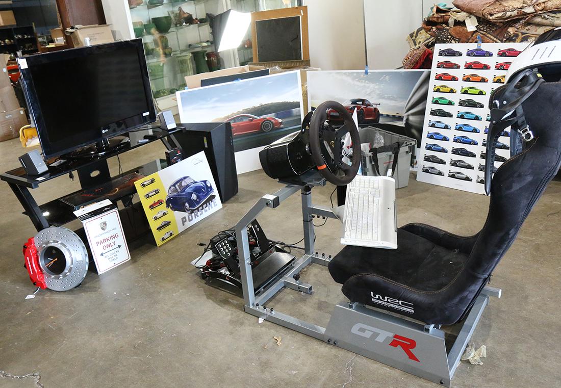Porsche racing simulator: (lot of 5) Porsche racing simulator, including a FIA World RAlly Championship playseat, custom fuel, brake, and clutch petals, Fanatec seven speed gear box, tiered stand LG flat screen monitor, 911 GT