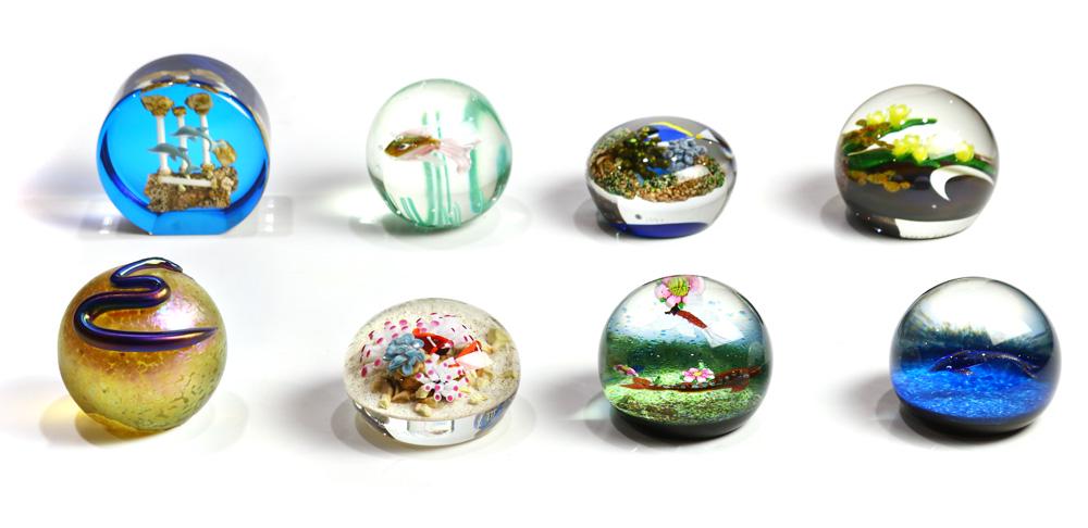 (lot of 8) Paperweight group: (lot of 8) Paperweight group, consisting of a Gordon Smith glass paperweight decorated with coral, marked with cased initials "GS," another decorated with cased tropical fish and "GS" initials, a Cait