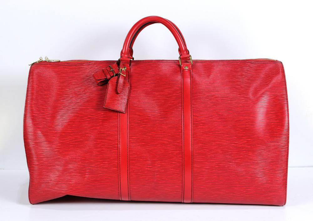 Louis Vuitton Epi Keepall travel bag: Louis Vuitton Epi Keepall travel bag, 50cm, executed in red Epi leather with black stitching, having a luggage tag and brass lock and key, 24"l x 10.5"w x 12.5"h