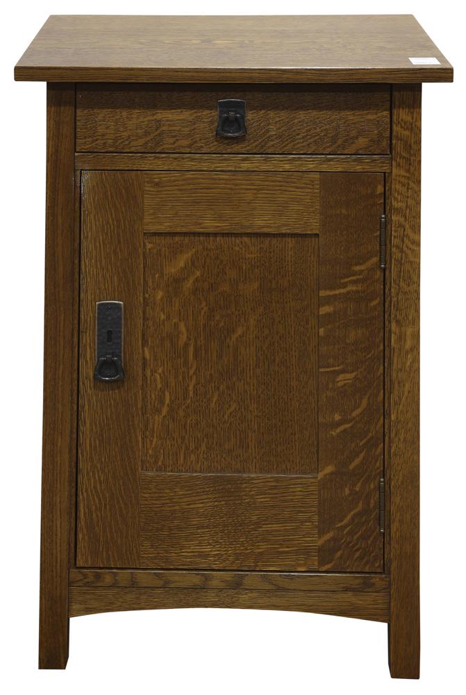 Stickley (Audi) Arts and Crafts style side cabinet: Stickley (Audi) Arts and Crafts style side cabinet, executed in quartersawn oak, having a single drawer over the panelled door, each with hammered copper pulls, and retains brand and metal plaque, 29"