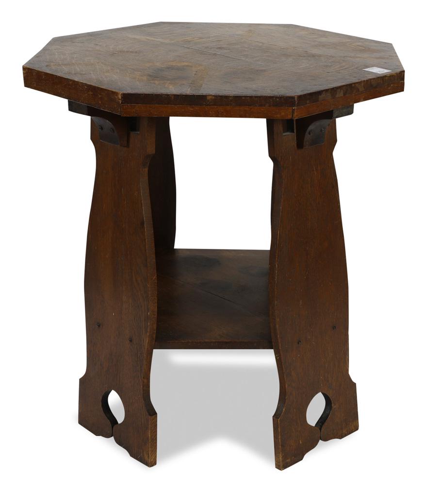 Arts and Crafts octagonal lamp table circa 1910: Arts and Crafts octagonal lamp table circa 1910, executed in quartersawn white oak, and rising on shaped cut out legs conjoined by the lower tier, 29.5"h x 28"w