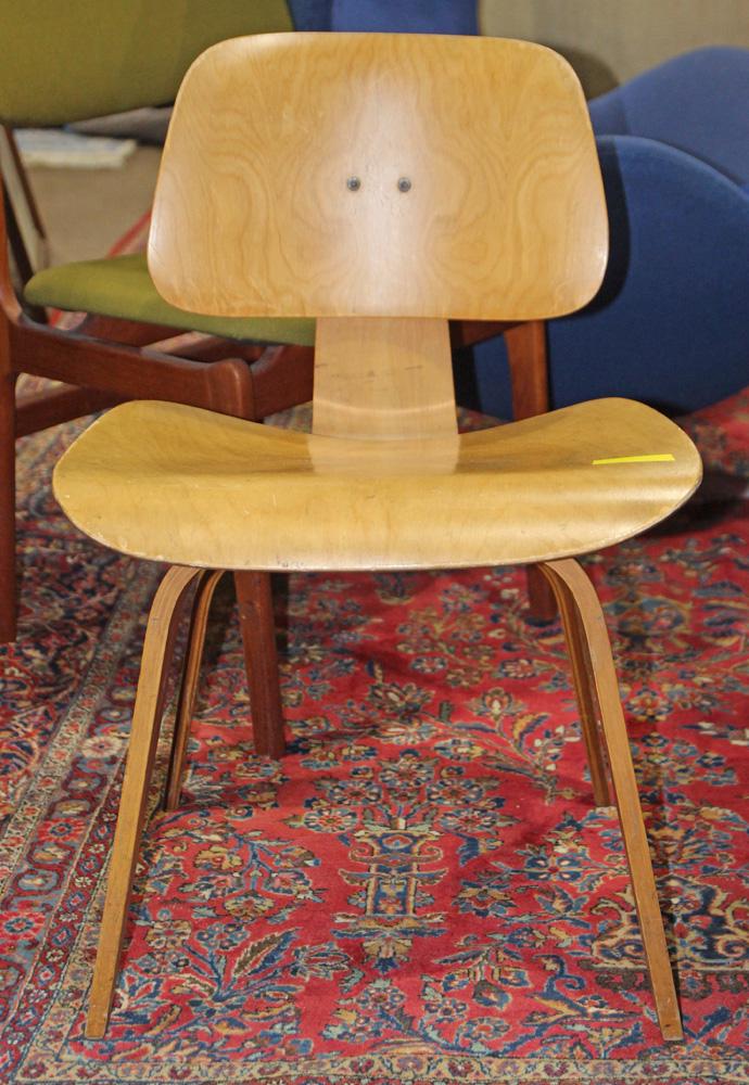 Charles and Ray Eames DCW lounge chair: Charles and Ray Eames DCW lounge chair, executed in bent plywood, 29"h