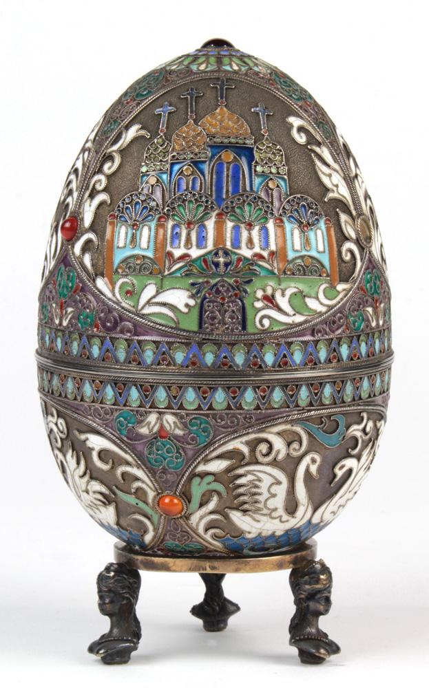 (lot of 2) Russian: (lot of 2) Russian .84 standard silver gilt enameled and beaded egg, bearing the Cyrillic marks of Pavel Ovchinnikov, the bipartite egg form cast with medallions of church domes, the bottom of the egg