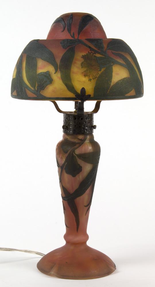 Cameo glass table lamp: Cameo glass table lamp, having a floral decorated shade, above a bauluster standard, signed Daum, Nancy, 15"h