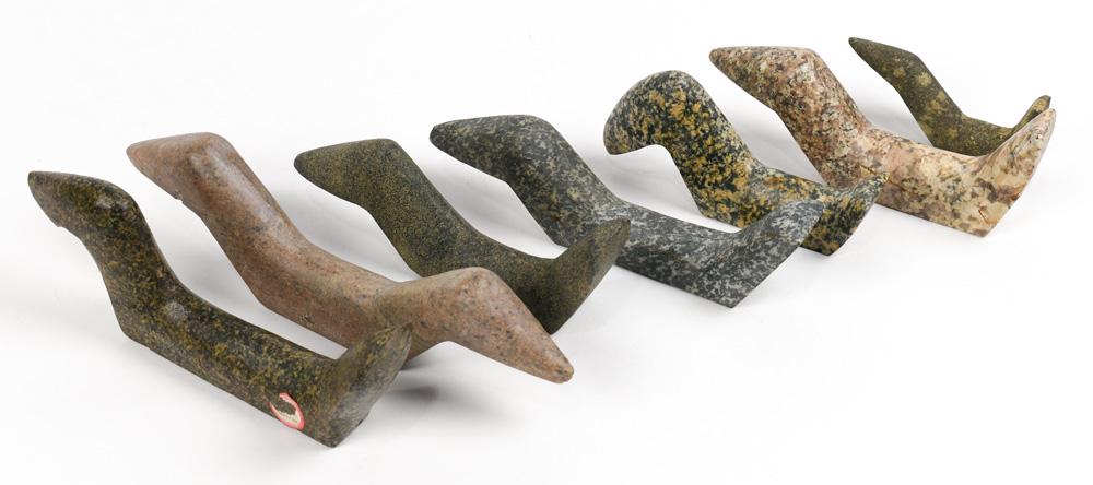 (lot of 7) Ohio Birdstone or atlatl weights: (lot of 7) Ohio Birdstone or atlatl weights, each carved in slate and granite, likely used as a weight on a dart or spear thrower, largest: 9.5"l