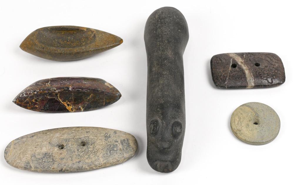 (lot of 6) Group of stone carved implements: (lot of 6) Group of stone carved implements, consisting of (2) Mississippian gorgets, largest: 5"l; two palettes, and a phallic statue ot halucinegenic mortar, some possibly ancient