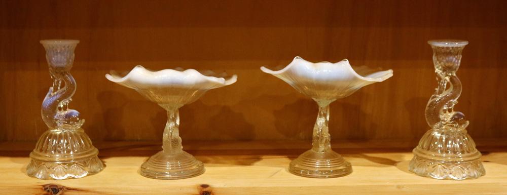 (lot of 4) Vaseline opalescent glass group: (lot of 4) Vaseline opalescent glass group, consisting of two dolphin form candlesticks, and (2) compotes with dolphin form standards, largest: 6"h