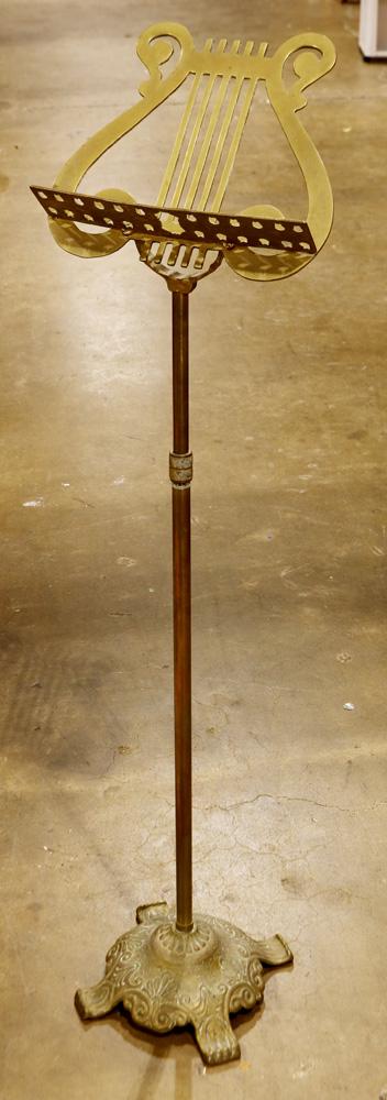 Brass music stand: Brass music stand, having a lyre form sheet music support, 43"h