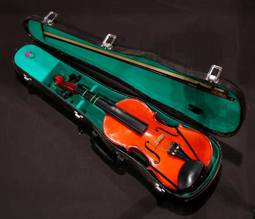 (lot of 2) Josef Bremen cased student violin and bow: (lot of 2) Josef Bremen cased student violin and bow, the spruce shaped case with ebonized bridge en suite with horsehair bow with silver winding and fitted case, 22"l
