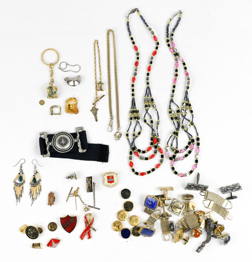 Collection of costume jewelry: Collection of costume jewelry Including 3) pairs of metal cufflinks; 14) single cufflinks, and parts; 7) metal button covers; 2) bead necklaces; 1) pair of malachite, metal earrings; 7) metal pins; 5)