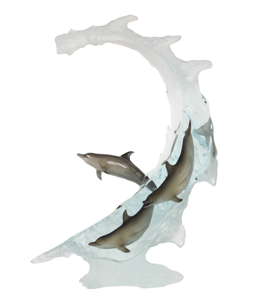 Robert Wyland acrylic sculpture: Robert Wyland (American, b. 1956) acrylic sculpture, depicting dolphins riding a cresting wave, signed and marked "WC," 21.5"h; Provenance: The Estate of Robin Leach, proceeds to benefit charities inc