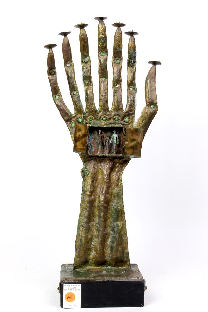 Pal Kepenyes Brutalist figural candelabra: Pal Kepenyes Brutalist figural candelabra, in the form of a hand, having seven lights, with finger supports having jeweled accents, above the palm, centered with a box opening to three figurines, and