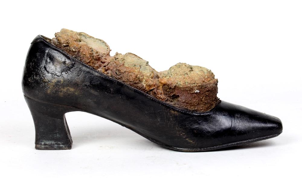 Steve Tobin: Steve Tobin (American, b. 1957) "Shoe with Round Cream Cakes" bronze sculpture, depicting mushrooms in a high heel, signed on underside: 6"h x 10"l; Provenance: The Estate of Robin Leach, proceeds to