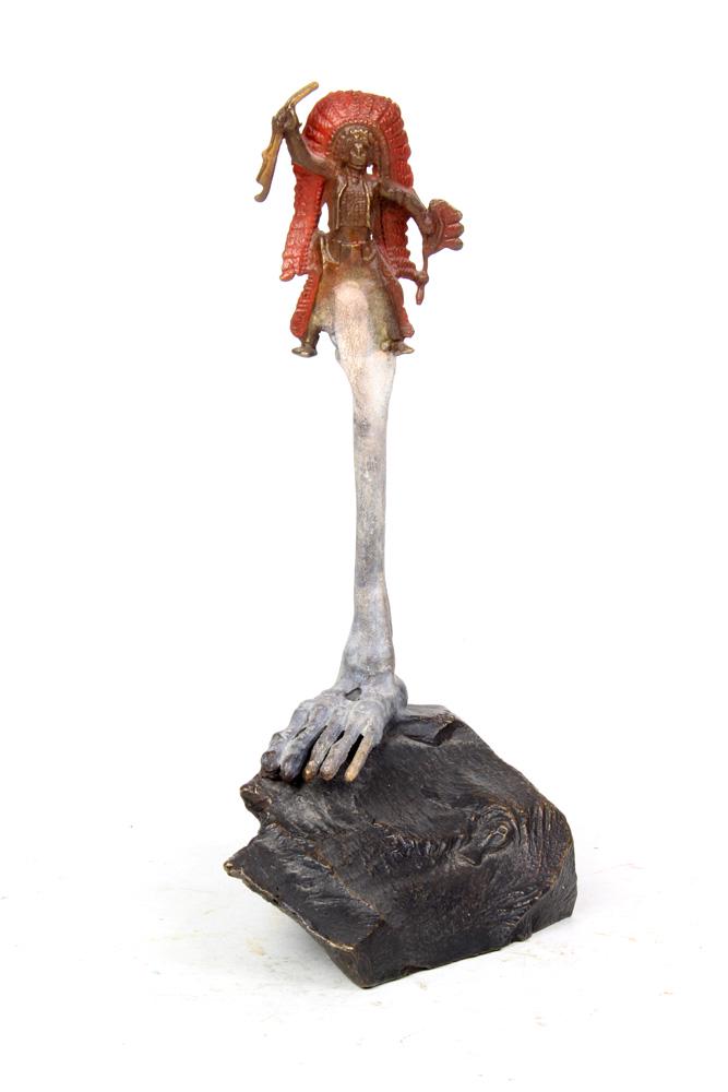 Steve Tobin: Steve Tobin (American, b. 1957) bronze sculpture, the Surrealist form decorated with a Native American grasping a rifle, above a skeleton leg, continuing to a rock form base, signed on underside, 6"h;