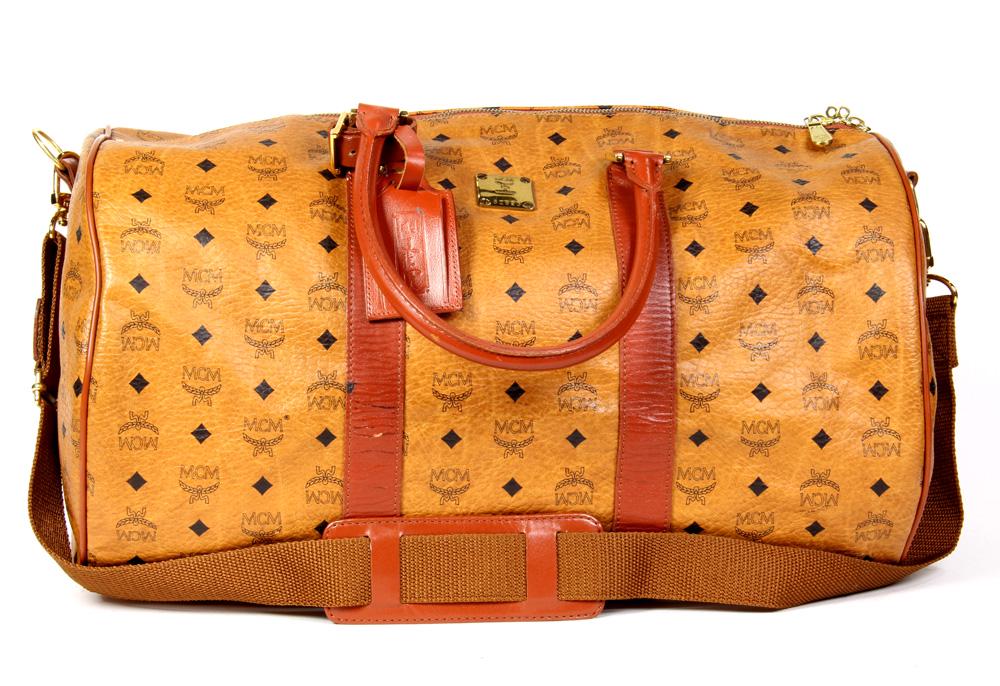 MCM Weekender Bandouliere: MCM Weekender Bandouliere, 50cm, executed in cognac and brown Visetos Coated Canvas, together with a strap, luggage tag, and handle strap, 50 x 29 x 43 cm