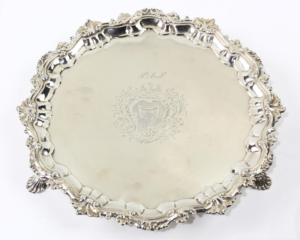 George II sterling salver, William Peaston, London,: George II sterling salver, William Peaston, London, circa 1746, the scalloped dishform tray with a shallow well, centering an engraved "P.A.S." coat of arms headed by a phoenix enclosing a wing, a lea