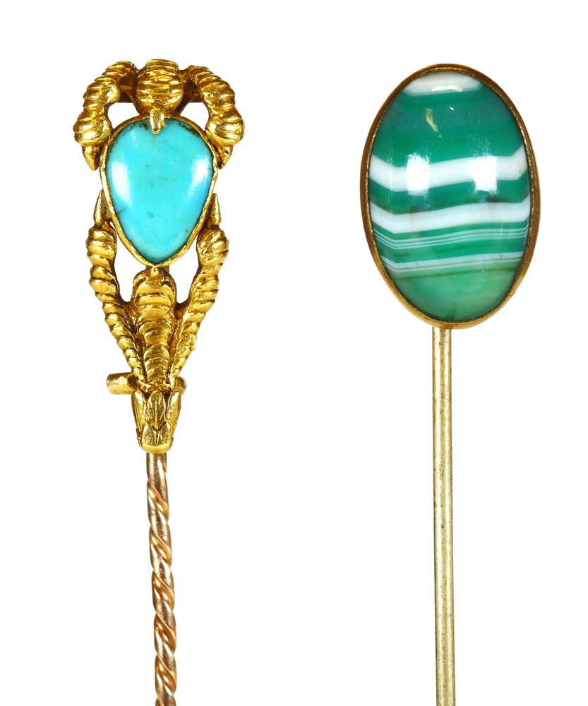 (Lot of 2) Multi-stone, yellow gold stickpins: (Lot of 2) Multi-stone, yellow gold stickpins Including 1) turquoise cabochon, 18k yellow gold talon motif mounting, hinged to expose on the reverse a locket compartment, completed by a 14k yellow gol