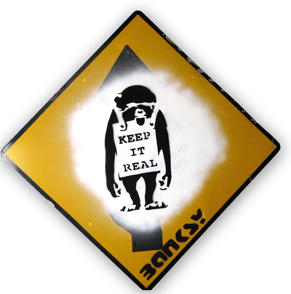 Spray paint, Manner of Banksy: Manner of Banksy (British, b. 1974), "Keep it Real," spray paint on street sign, bears signature lower center, overall (unframed): 33"h x 33"w