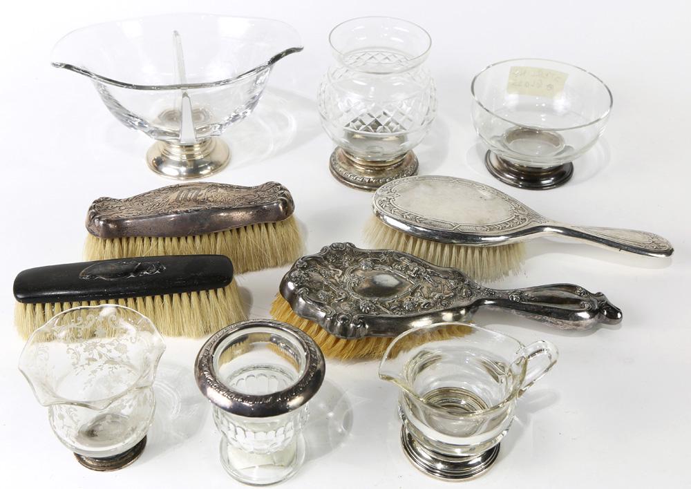(lot of 11) Sterling mounted dresser and table articles: (lot of 11) Sterling mounted dresser and table articles, comprising (3) sterling covered glass vases or bowls; (4) sterling mounted brushes; (2) sterling weighted cigarette or a toothpick urns; a ster