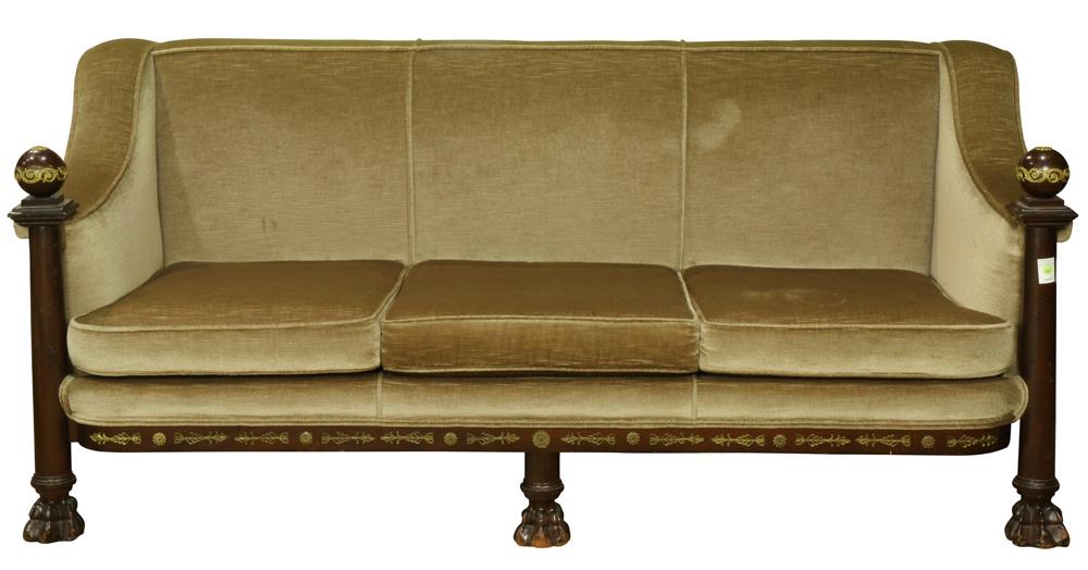 French Empire style Custom Crafted three seat sofa: French Empire style Custom Crafted three seat sofa, upholstered in beige, the arms having spherical finials, and rising on paw feet, 34"h x 75"w x 22"d
