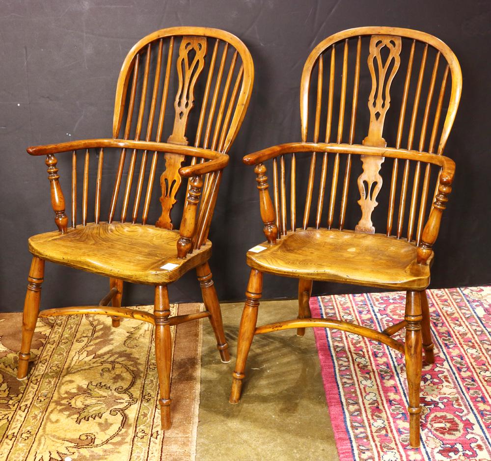 Pair of English windsor style hoop back or double bow: Pair of English windsor style hoop back or double bow armchairs, the shaped back splat with honeysuckle pattern, and rising on turned legs, 39"h